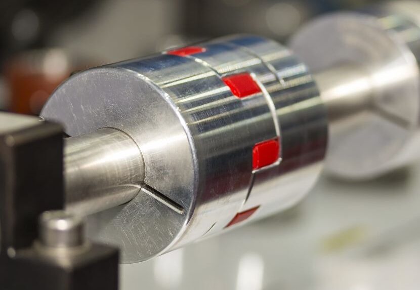 Close-up of a flexible shaft coupling used in precision industrial machinery.